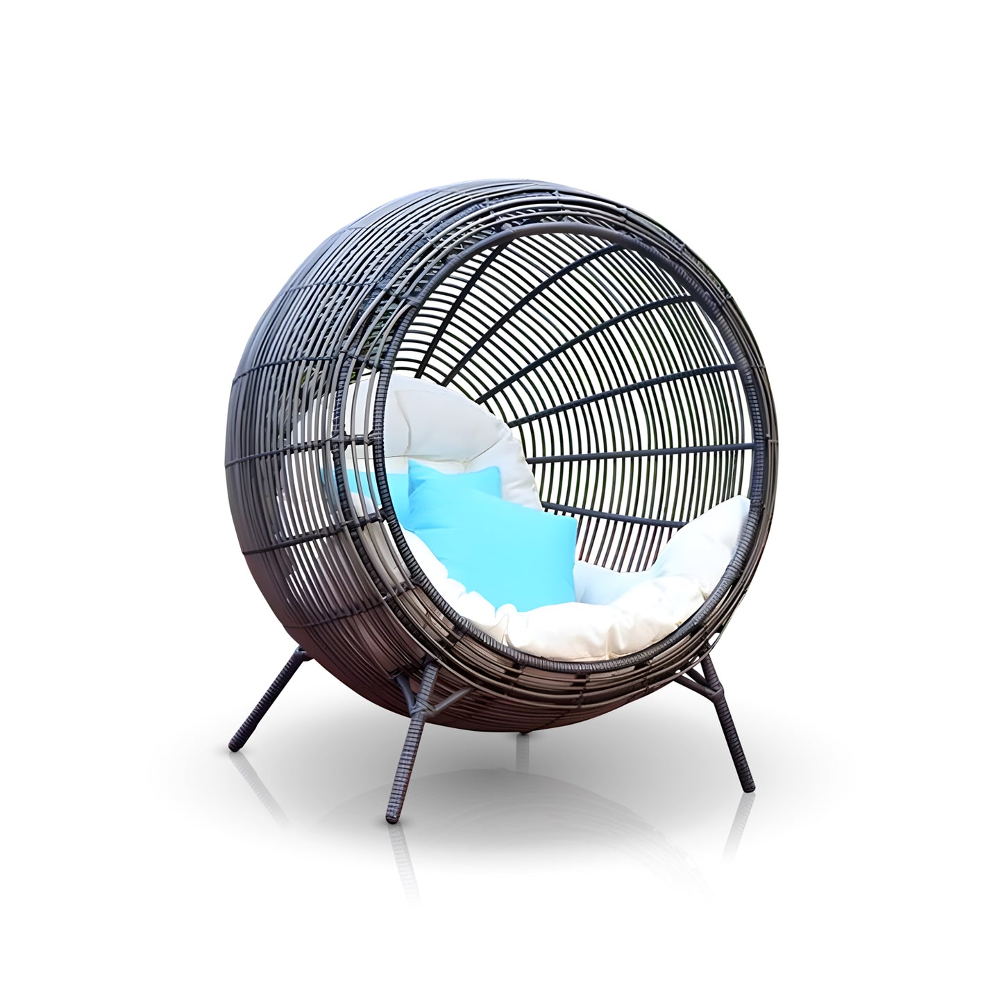The Sphere Retreat Lounge by Landmark Decor features a spherical black wicker design with four legs, a cozy white cushion, and a blue accent pillow. Ideal for outdoor living, its open weave offers a luxurious retreat against a simple white backdrop.