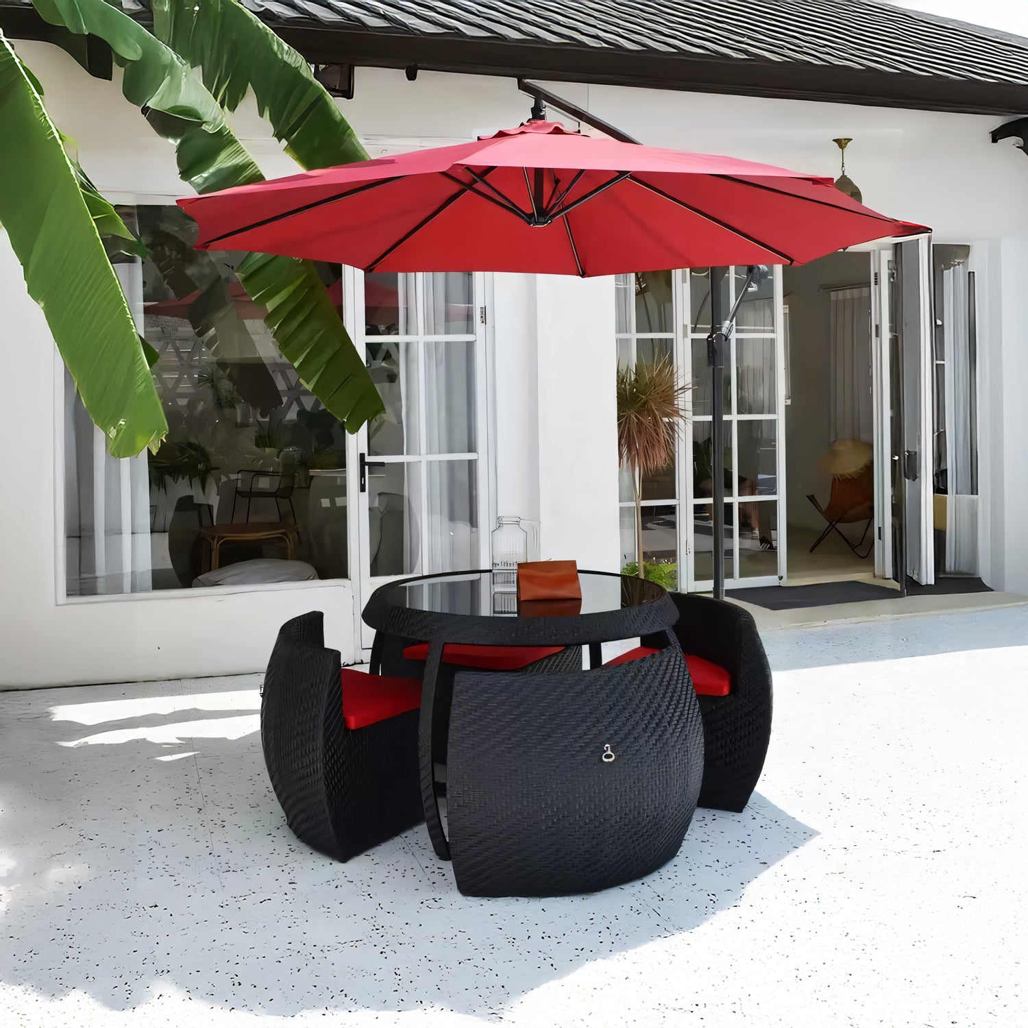 black patio set with a red umbrella Midnight Riviera Collection – Landmark Decor