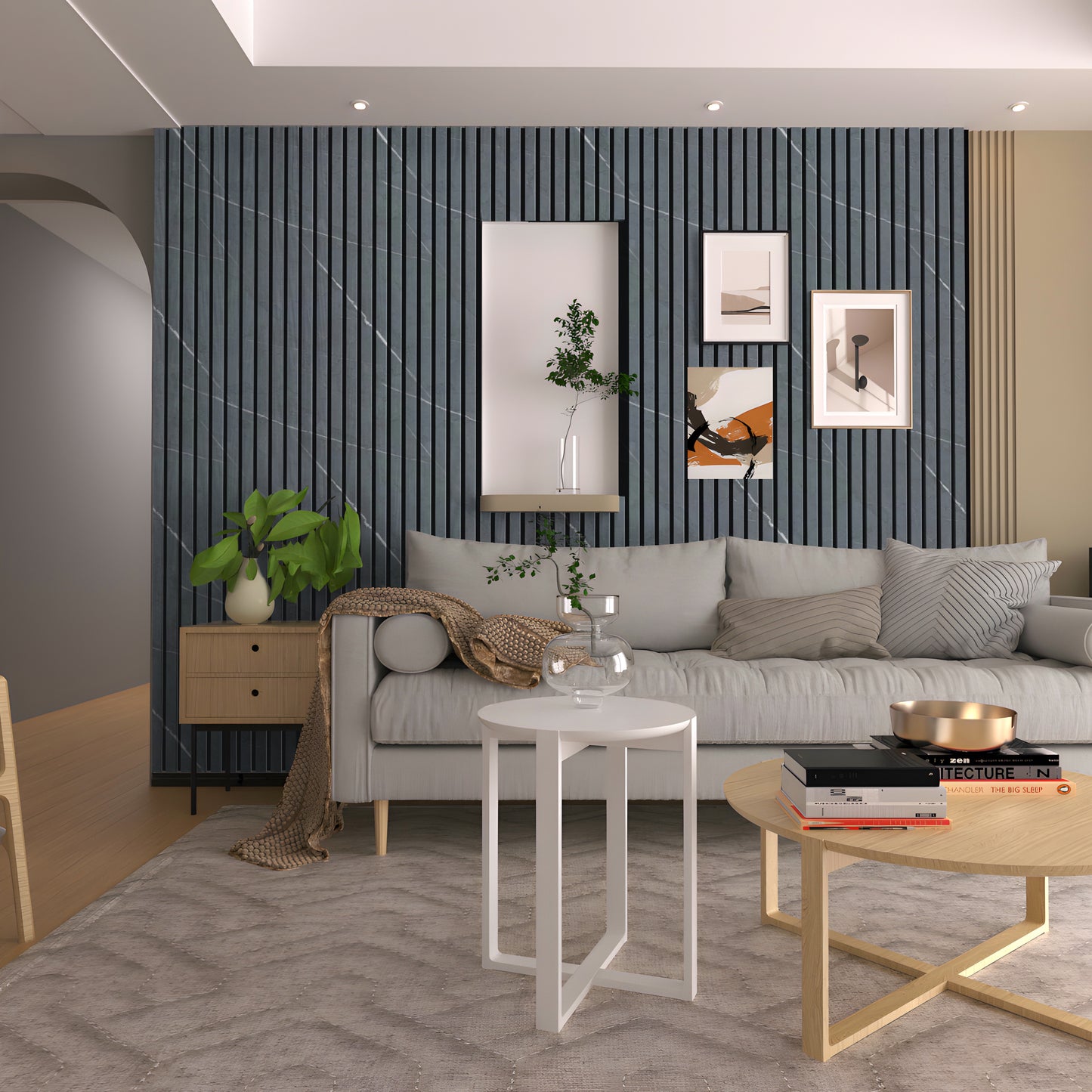 Modern living room with a light gray sofa, geometric tables, wall art, indoor plants, and a textured dark accent wall featuring Landmark Decor’s Black Marble WPC Fluted Slat Wall Panel with built-in shelving.