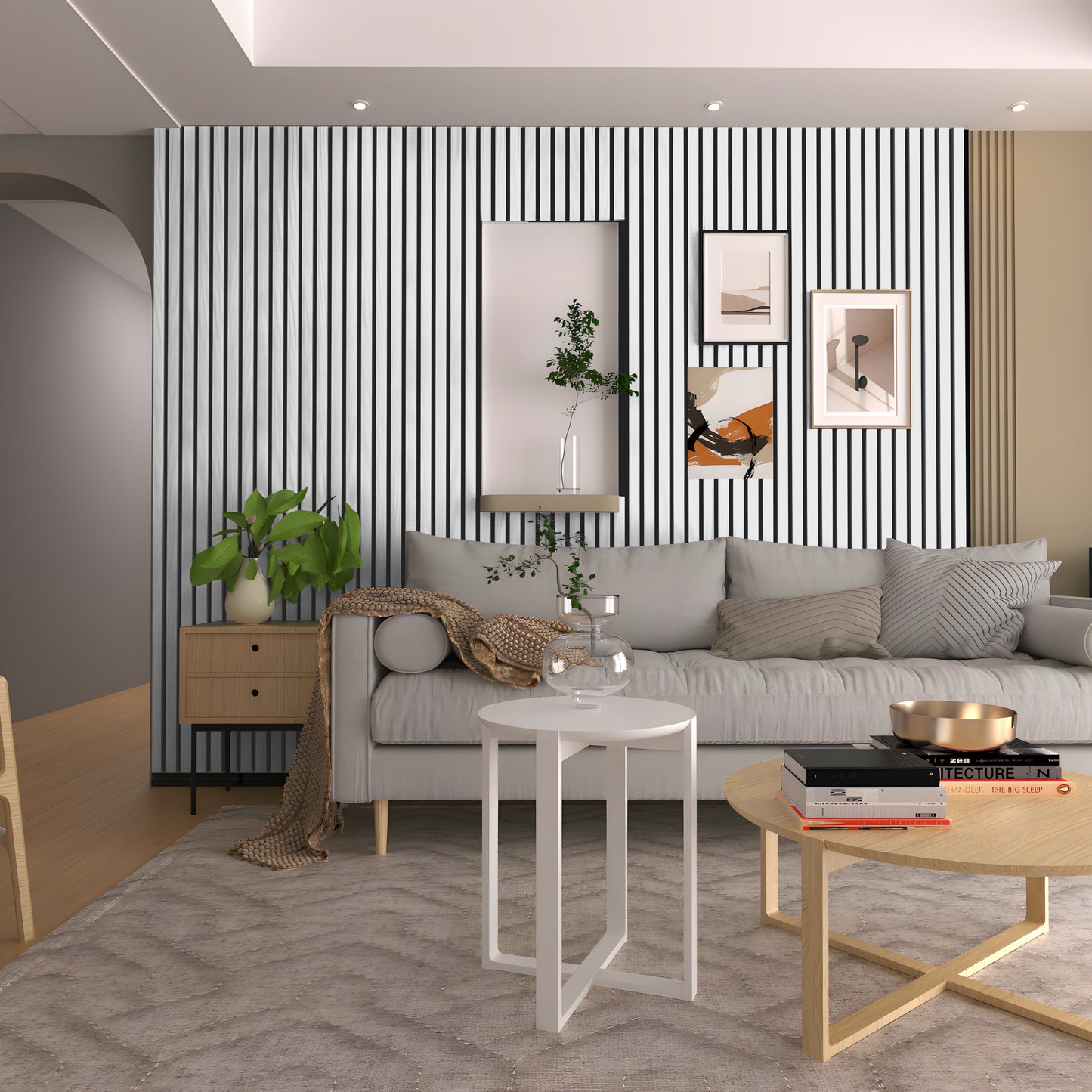 Modern living room with a striped accent wall using Landmark Decor’s Paper White WPC Fluted Slat Wall Panel, plus a gray sofa, small tables, framed art, plants, and neutral decor.