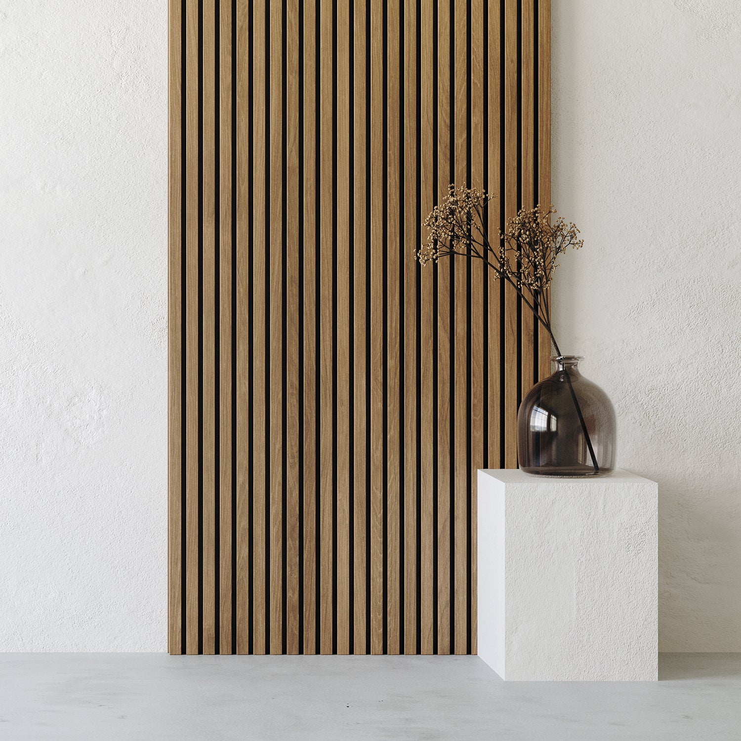 A glass vase with dried branches sits on a white pedestal in front of Landmark Decor's Exterior Wall Panel Keel, set against a white textured background.