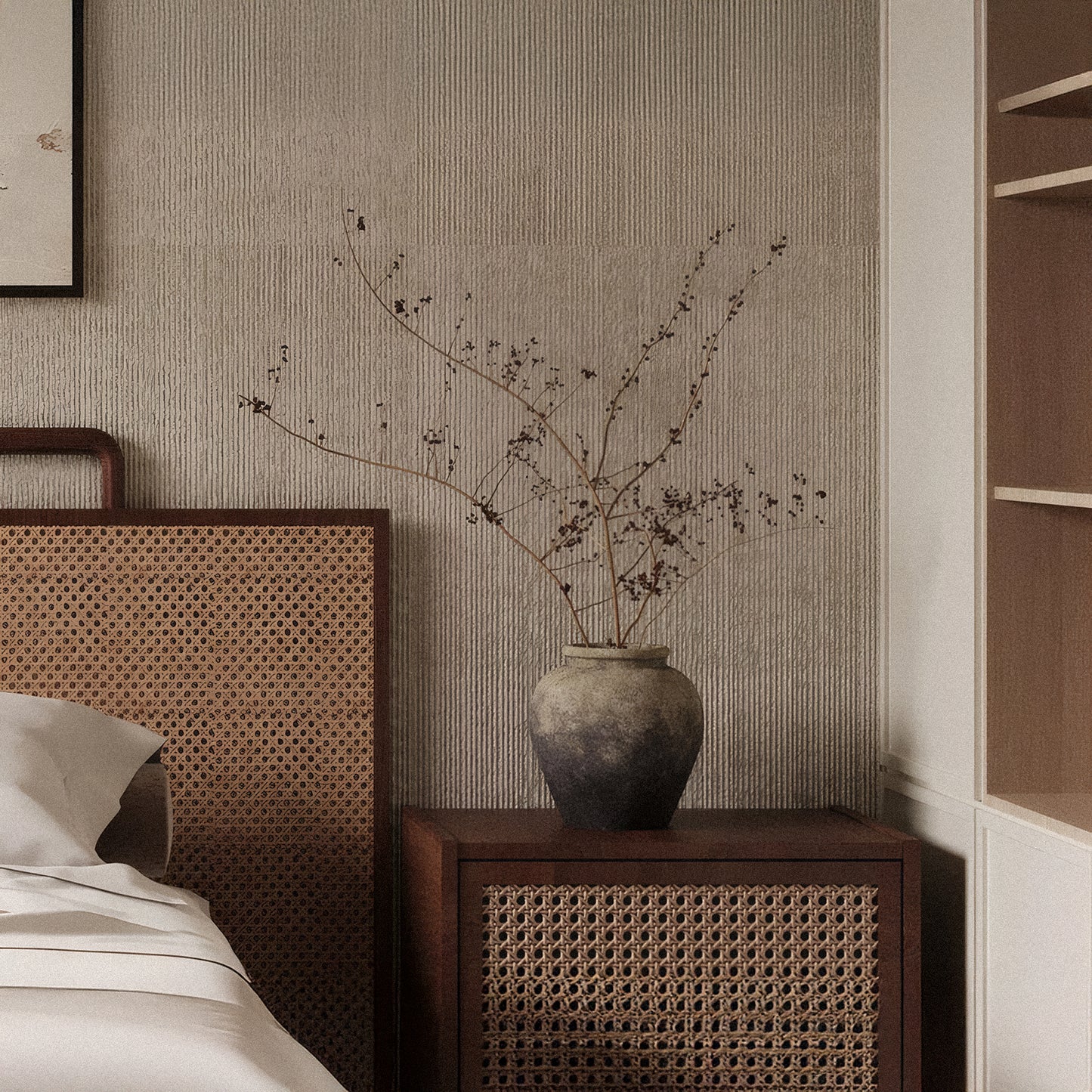 A ceramic vase with dried branches sits on a wooden nightstand beside a bed with a rattan headboard, while Landmark Decor’s Cut Stone Sheet - Beige lends subtle texture to this neutral-toned bedroom.