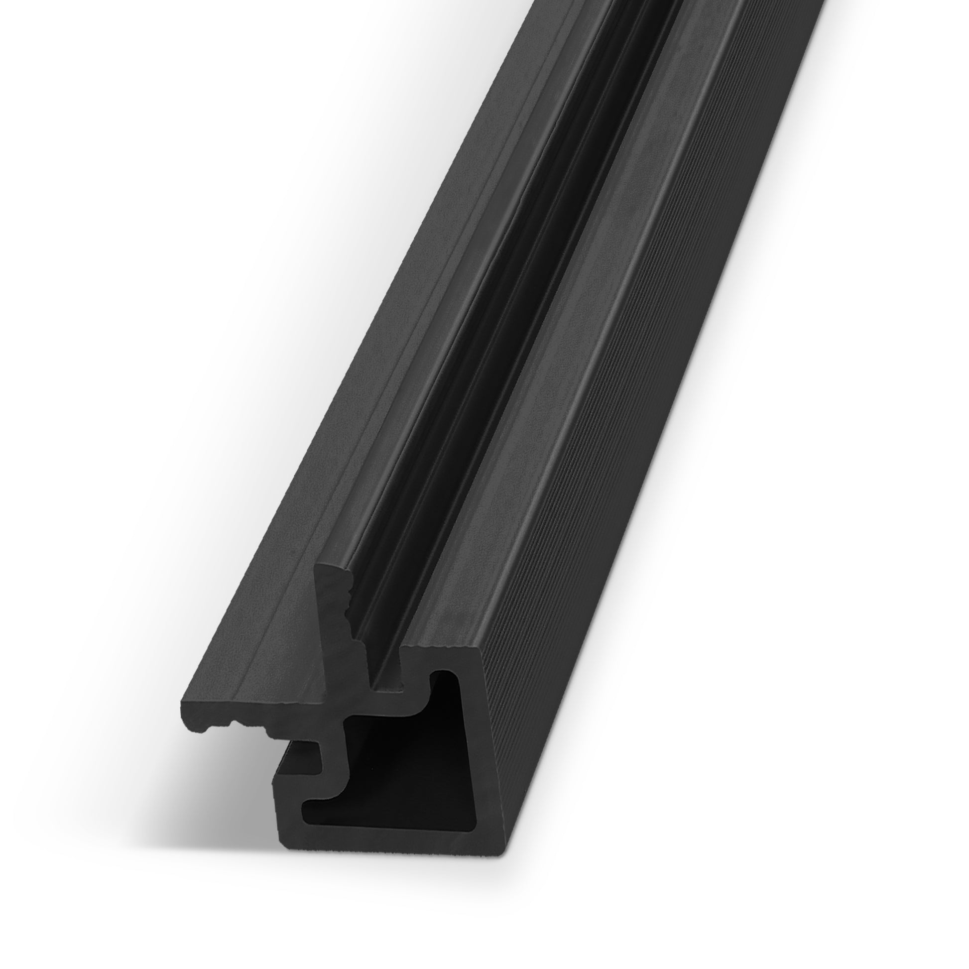 Here is the sentence rewritten using your provided product data: The Landmark Decor Urban Shadow Exterior Panel End Piece—a black, grooved extruded profile with a complex cross-sectional shape, commonly used as an end piece for exterior wall installations or WPC wall panel systems—is photographed diagonally on a white background.