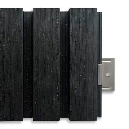 Close-up of Landmark Decor Exterior WPC Panel Clips securing dark textured wall panels, with a visible metal mounting bracket on the right side highlighting reliable installation.