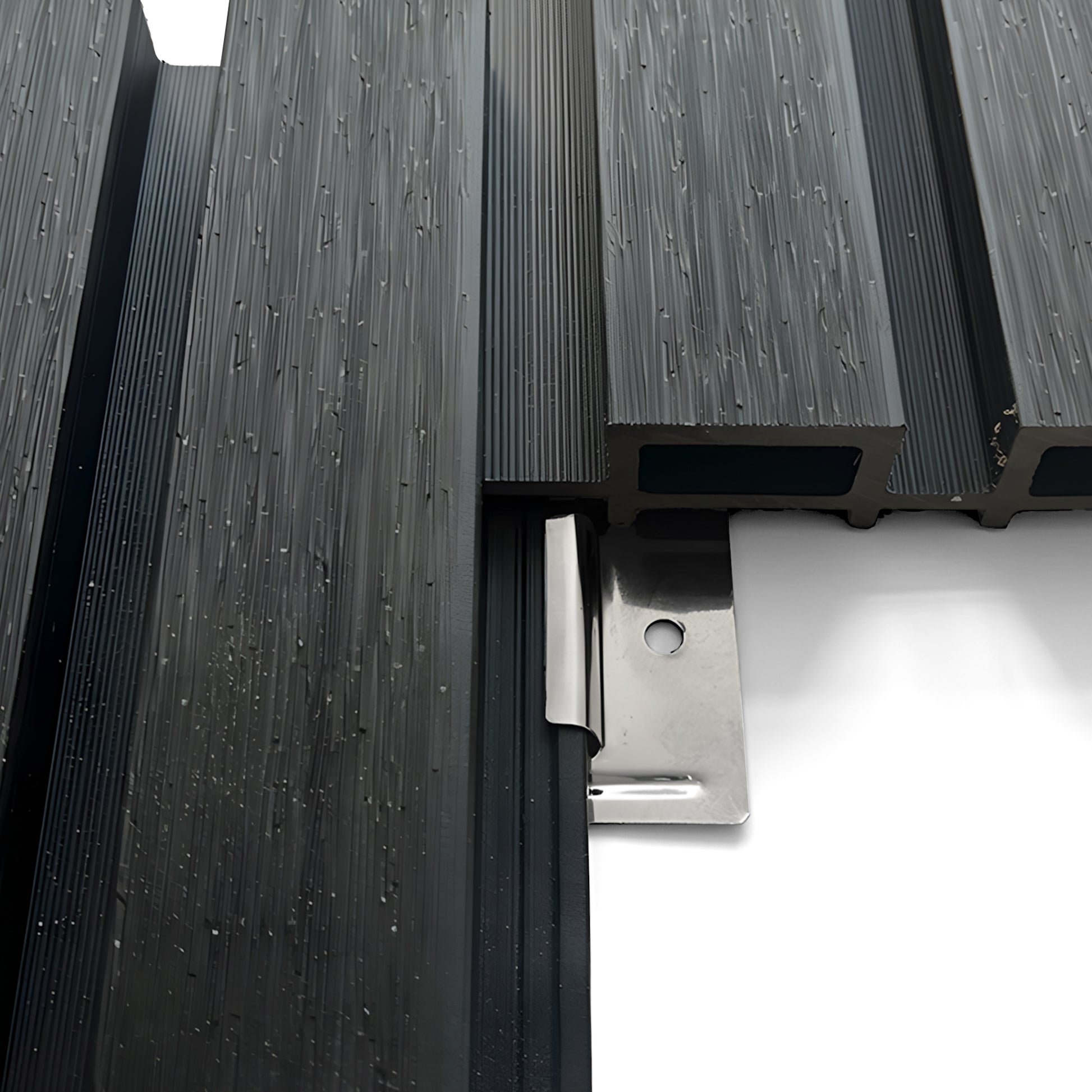 Close-up of Landmark Decor Exterior WPC Panel Clips securing black composite decking boards with a silver metal hidden fastener on a white background.