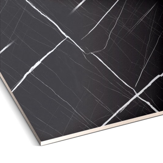 Close-up of Noir Frost Marble Durable PVC Wall by Landmark Decor, featuring a black surface with white intersecting veins—ideal for marble-inspired interiors or as decorative PVC marble wall panels.