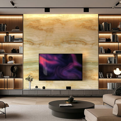 Modern living room featuring Landmark Decor's Opal Forest Marble Durable PVC Wall with decorative panels, built-in shelves, a mounted TV, round coffee table, and neutral-toned furniture—showcasing sophisticated interior design.