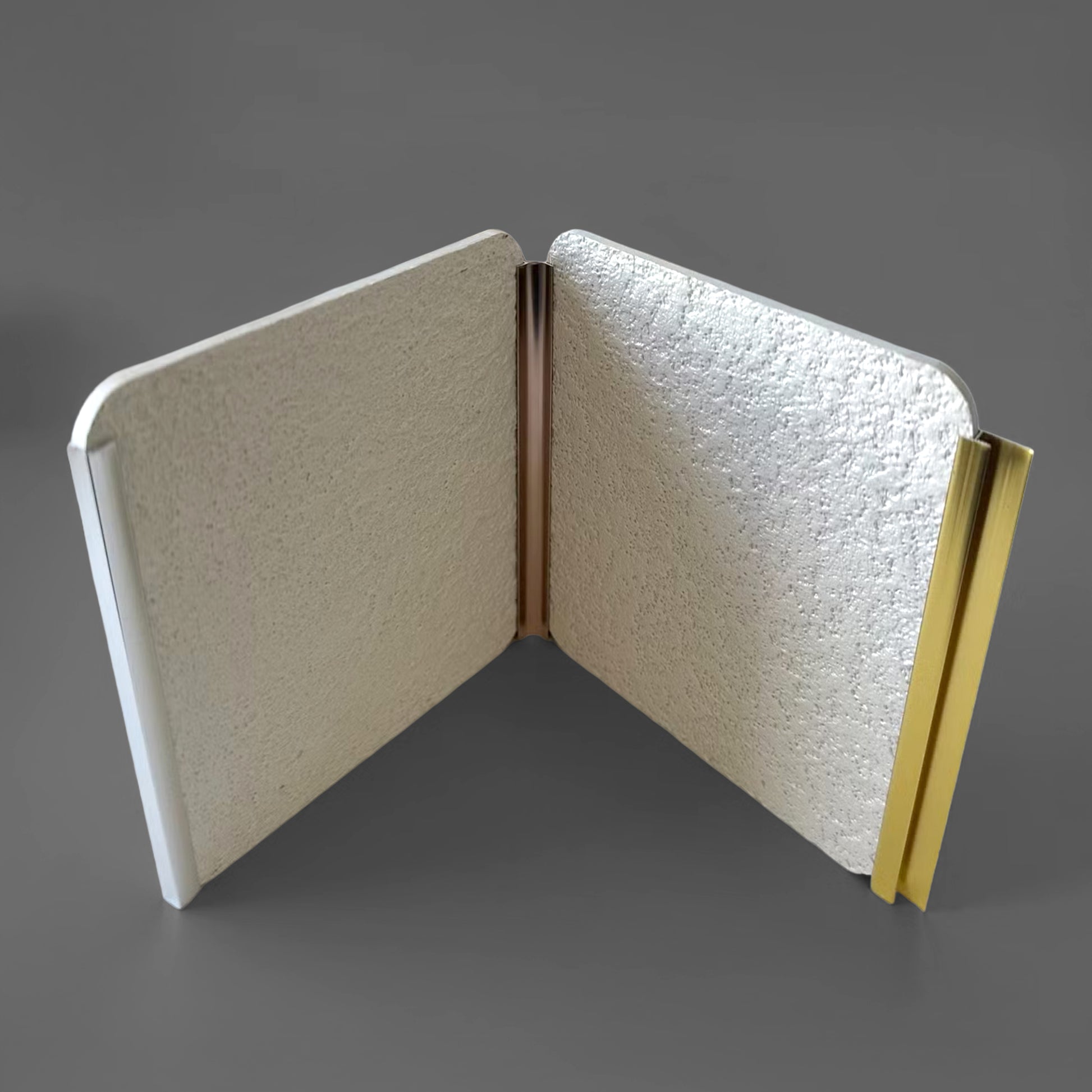 Landmark Decor's PVC Wall Inner Corner Strip is shown joining two rectangular panels neatly at a right angle, with clean edges, against a plain gray background—ideal for creative wall panel installations.