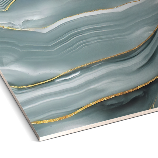 Close-up of Serene Glacier Marble Durable PVC Wall by Landmark Decor, showcasing abstract blue and white waves with metallic gold lines—perfect for pairing with decorative panels or PVC marble wall panels to enhance any interior.