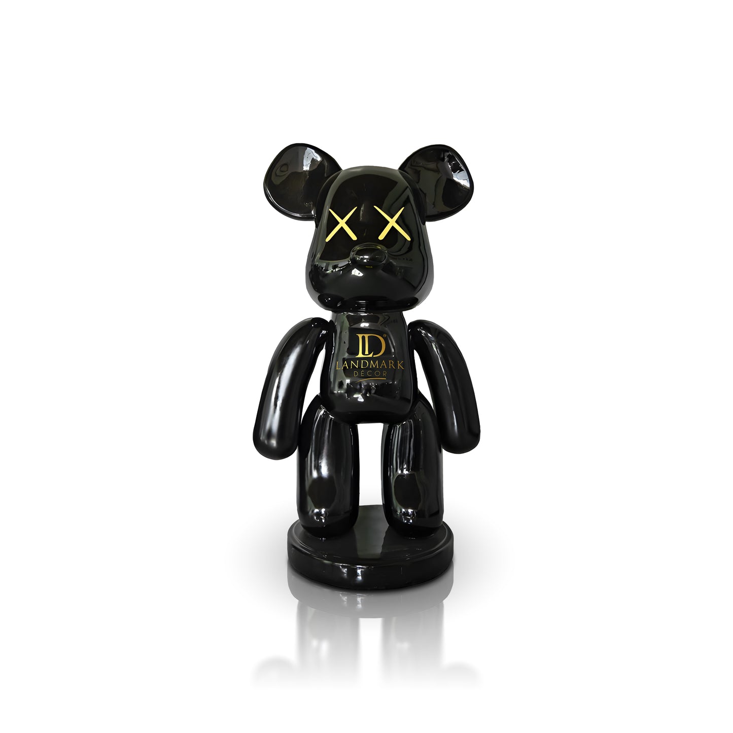 The Black Bear - Large by Landmark Decor features a glossy black bear shape with yellow X eyes and "Landmark" on its chest, standing on a round base—an ideal addition to your artistic sculpture or Landmark Decor collection.