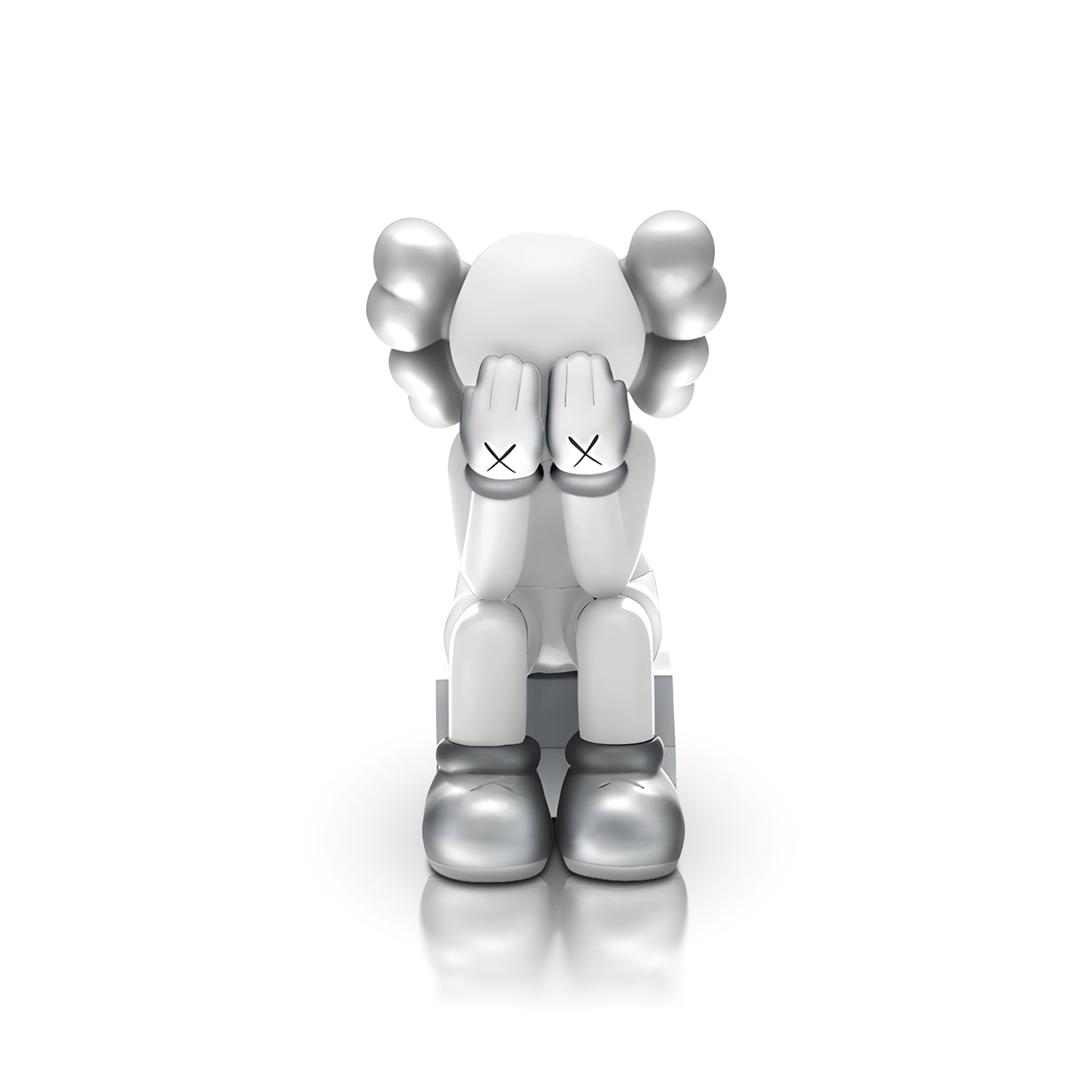 Veiled Thoughts - Electroplated by Landmark Decor features a gray and white cartoon figure with its head down, hands covering its face, and X marks on the hands—an artistic sculpture perfect for standout interior decor.