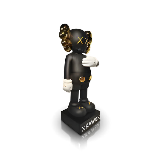 The "In Motion" figure by Landmark Decor features a black and gold KAWS Companion standing on a base with "KAWS," iconic X-shaped eyes, and gloved hands—a blend of modern sculpture and decor.