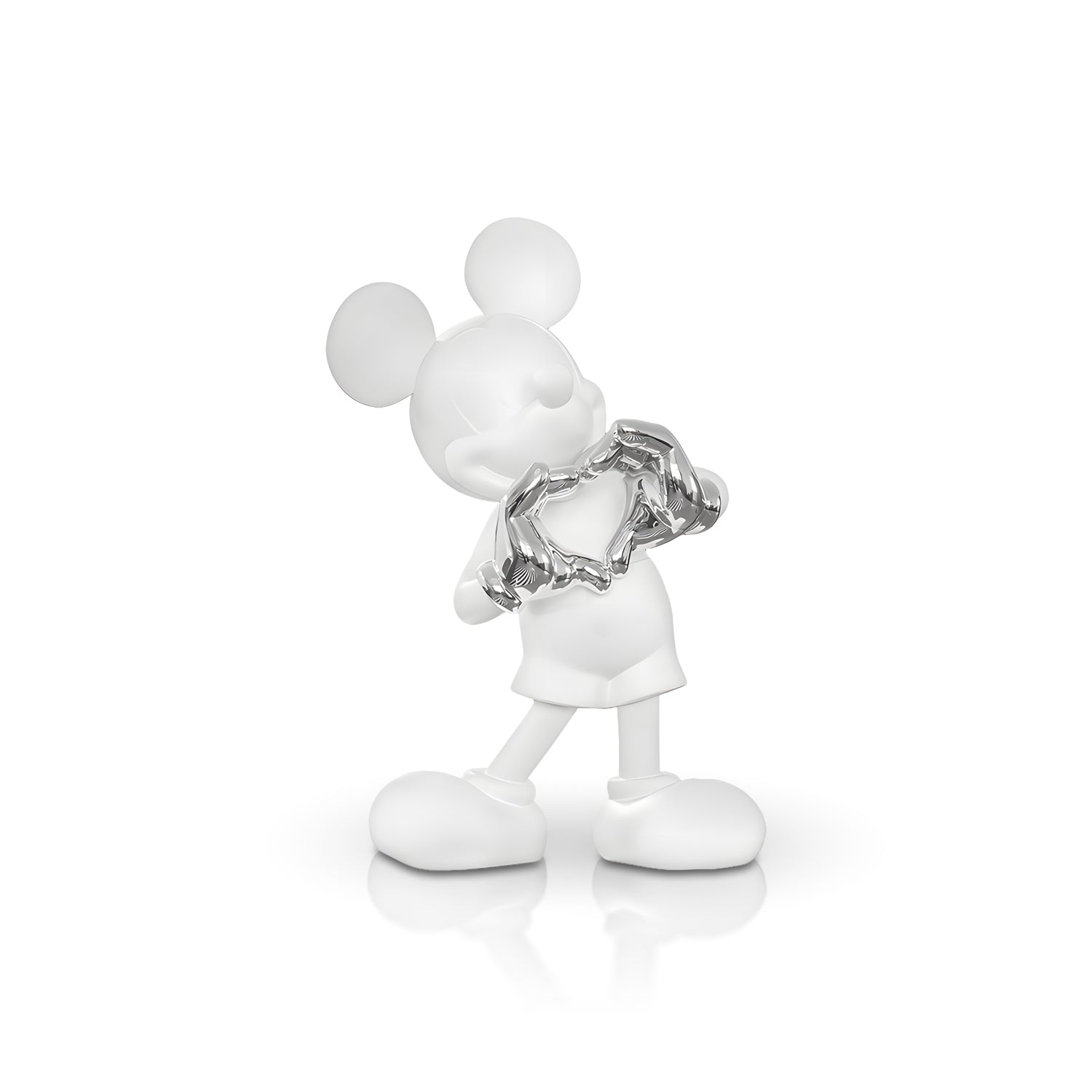The Heart U - Large by Landmark Decor is a white cartoon mouse figurine holding a shiny silver broken heart, standing on a reflective surface—an artistic sculpture ideal for unique home decor.