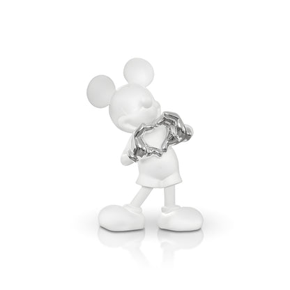 The Heart U - Large by Landmark Decor is a white cartoon mouse figurine holding a shiny silver broken heart, standing on a reflective surface—an artistic sculpture ideal for unique home decor.