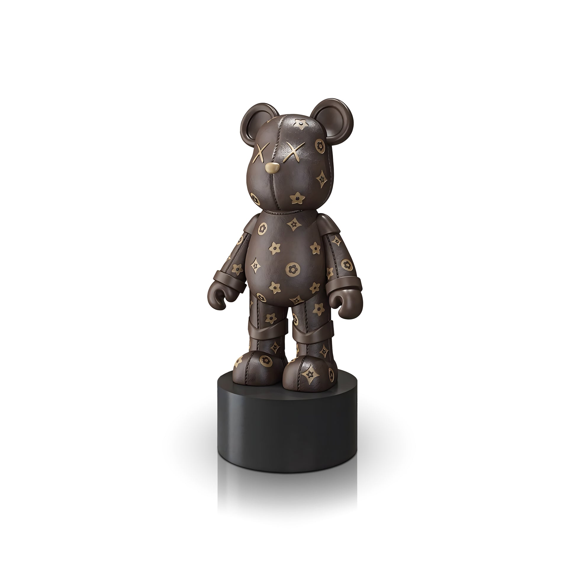 The Landmark Decor Brown Bear is a charming bear-shaped figurine with gold star and flower designs on a brown surface, set on a round black pedestal—an enchanting accent to enhance any room’s décor.