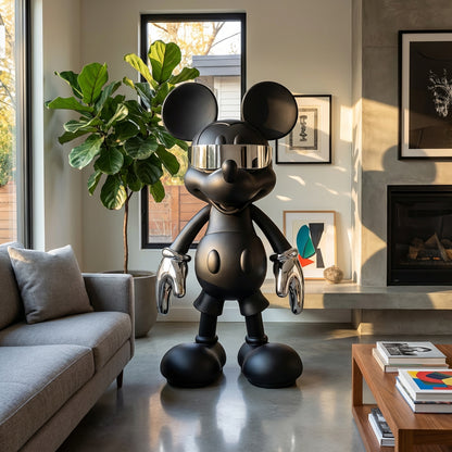 Stay Cool by Landmark Decor is a large black Mickey Mouse-inspired statue with metallic gloves and visor, making a bold artistic statement in a modern, light-filled living room.