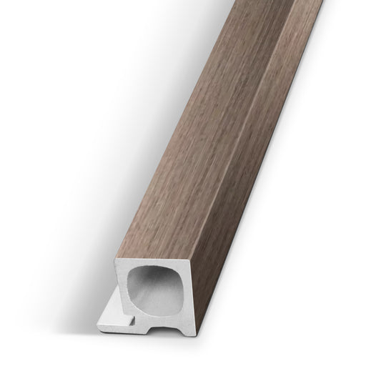 A close-up of the Landmark Decor Taupe Interior WPC Panel End Piece, featuring a woodgrain finish and a hollow rectangular cross-section, shown at an angle on a white background.