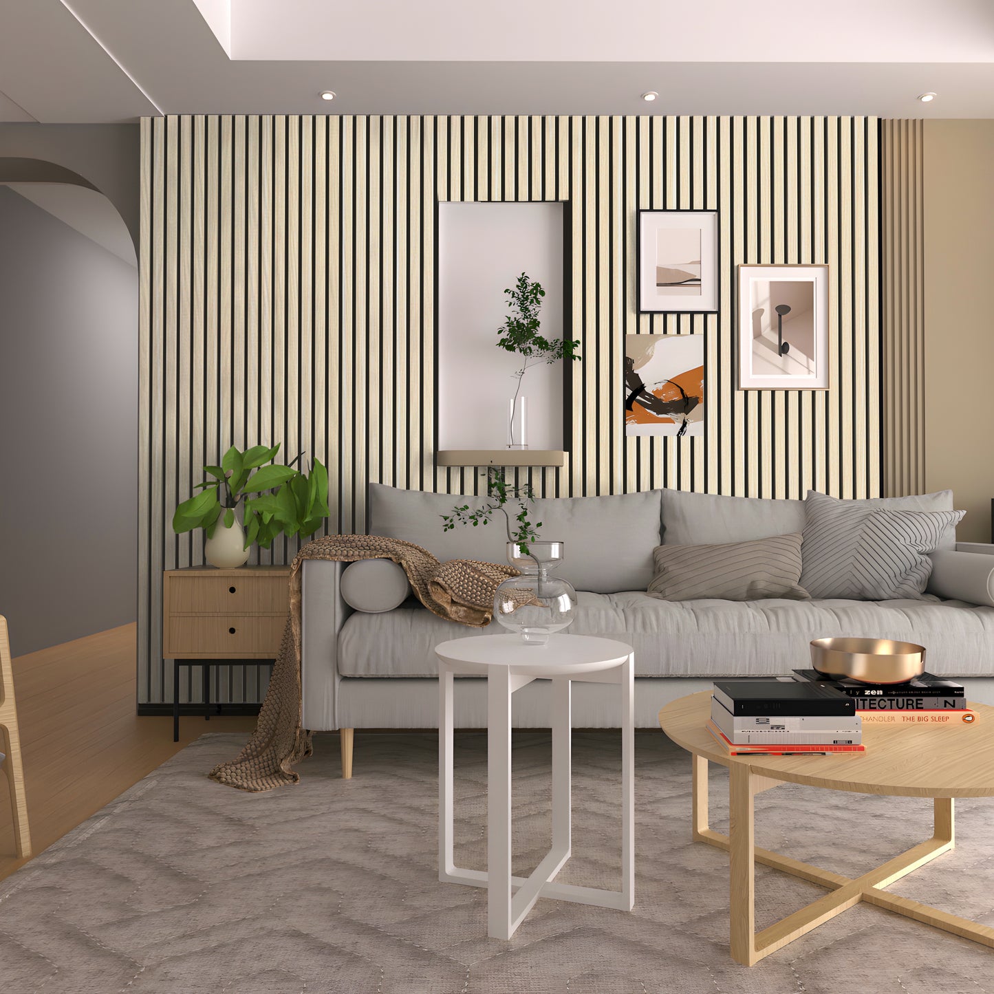 Modern living room featuring a light gray sofa, Landmark Decor’s Ebony Gray WPC Fluted Slat Wall Panel, framed art, round coffee tables, indoor plants, and neutral decor.