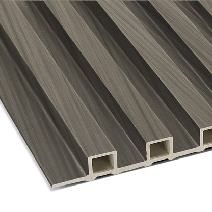 A close-up of the Ebony Chevron WPC Fluted Slat Wall Panel by Landmark Decor shows its brown, grooved, rectangular design with lengthwise hollow sections—perfect for stylish wall cladding or modern interior panels.