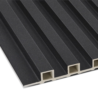 A close-up of the Landmark Decor Obsidian Shadow WPC Fluted Slat Wall Panel shows its black, grooved, rectangular design with hollow channels—perfect for stylish accent walls or contemporary wall cladding.