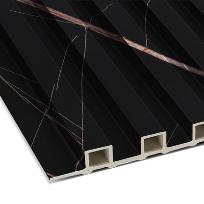 Close-up of the Rosso Noir Vein WPC Fluted Slat Wall Panel by Landmark Decor—black, ridged cladding with thin white and brown veins and hollow rectangular edges, perfect for modern accent walls.