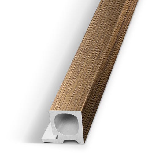A long, narrow wood-look trim or molding piece shown diagonally on a clean white background, with a square cross-section and hollow center channel.