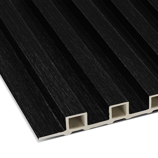 A close-up of the Landmark Decor Black WPC Fluted Slat Wall Panel shows its grooved, rectangular design and white hollow interior—ideal for accent walls or ceiling panels.